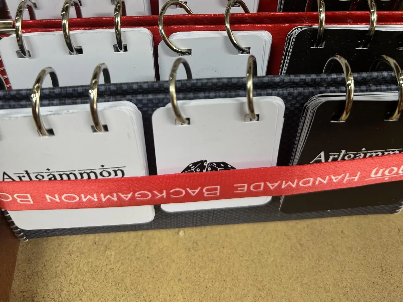 ArtGammon flip score boards with numbered cards on metal rings